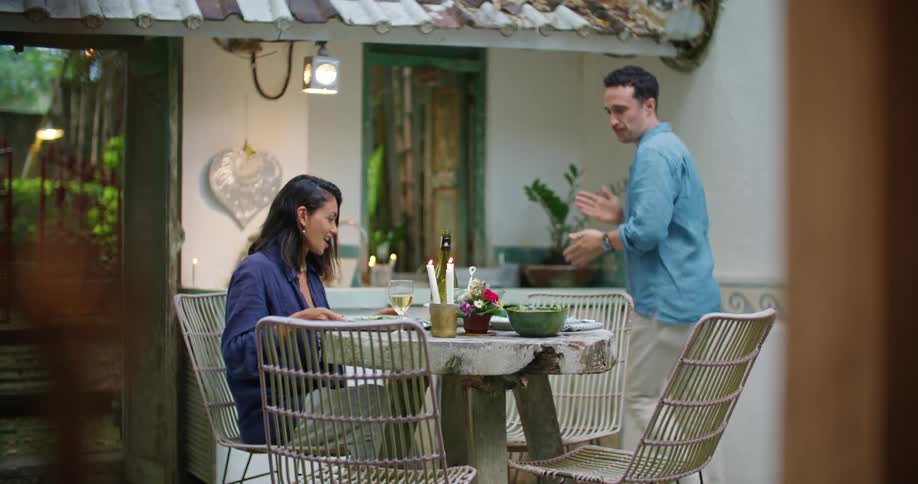 Man serves a hearty meal for his wife in the backyard at home
