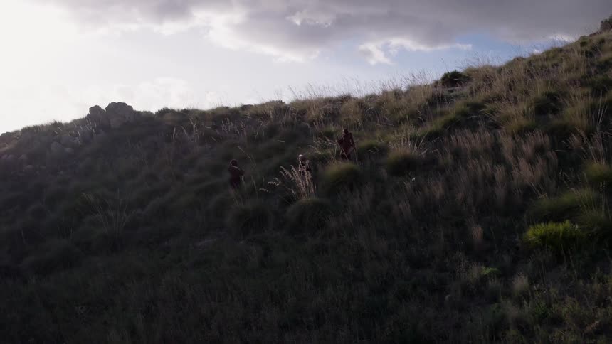 The hills are covered with grass on a cloudy day