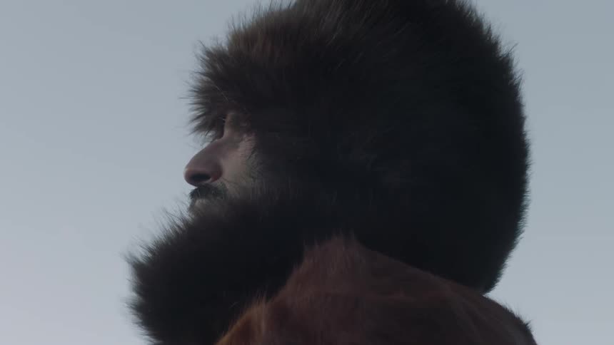 A man stands in the breeze looking forward