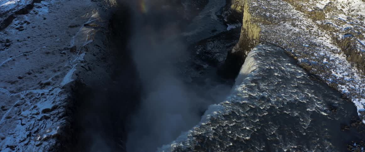 Water flowing over a cliff in the winter
