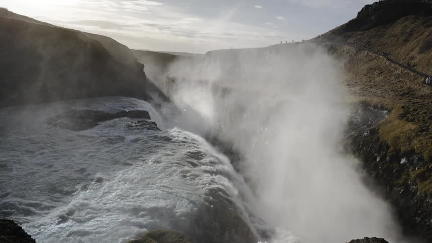 Water flowing over a canyon in winter