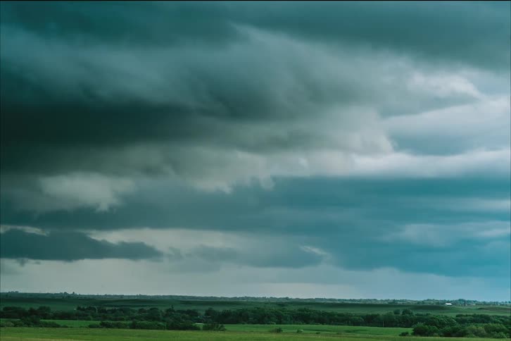 Big threatening storm clouds roll in over a remote area