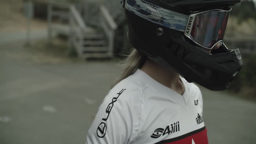 A woman is earing a crash helmet