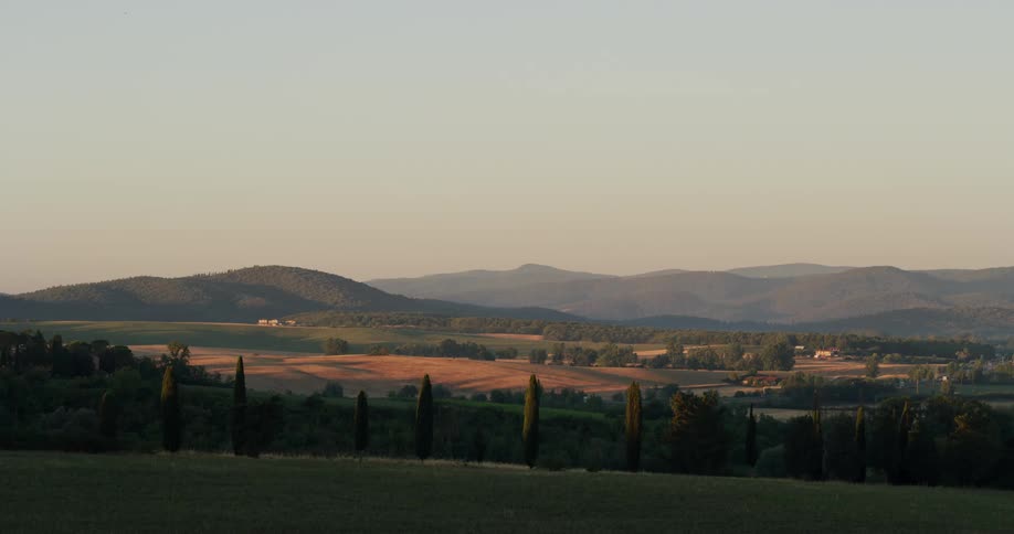 Fields and villas on the gentle slopes of the hills on the countryside at morning