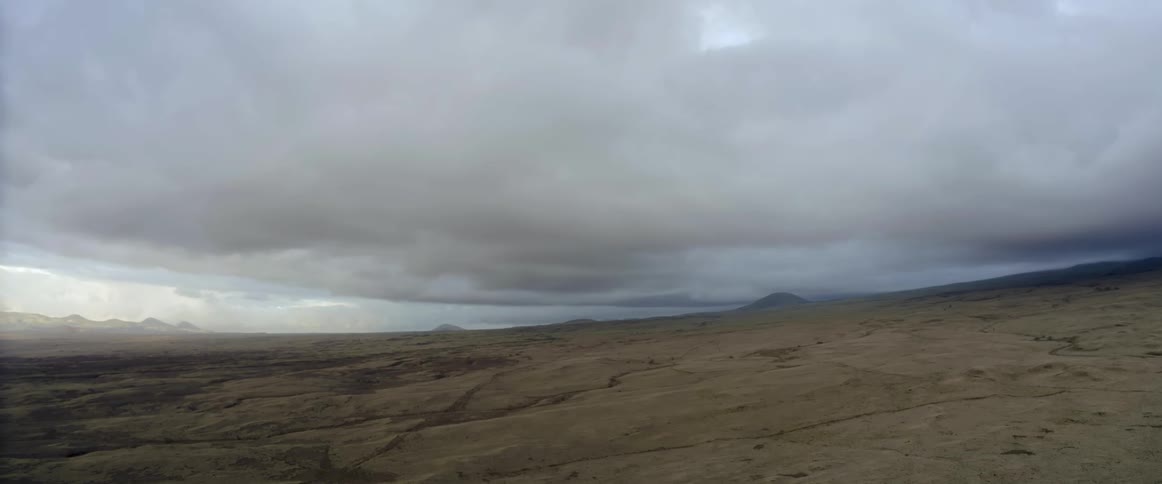 Storm clouds floating above plains