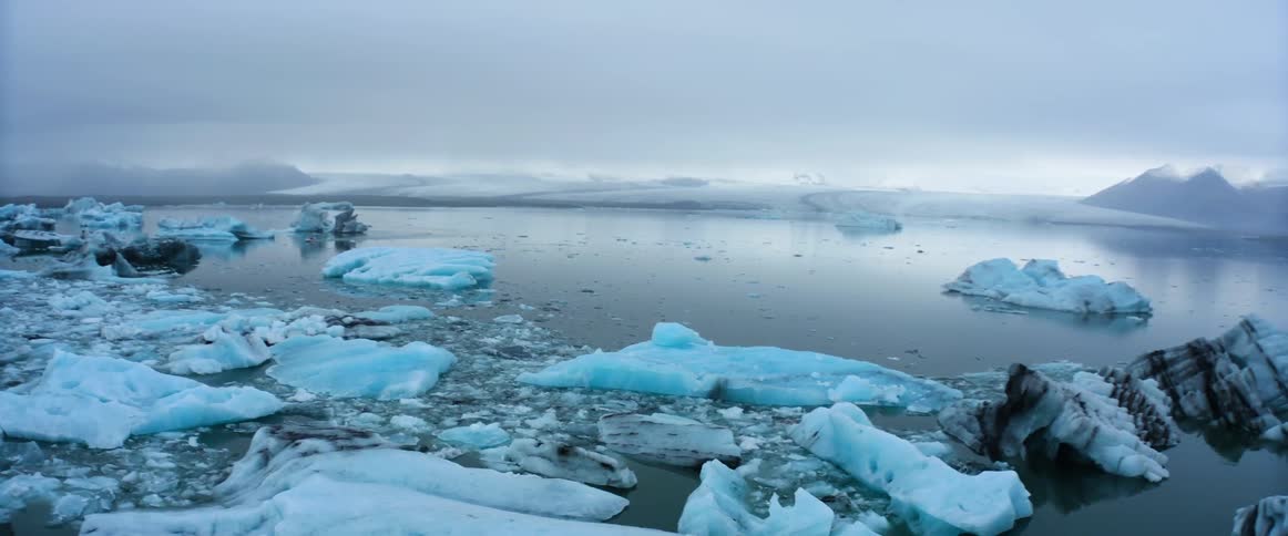 Camera slowly pans to the right over arctic ice floes