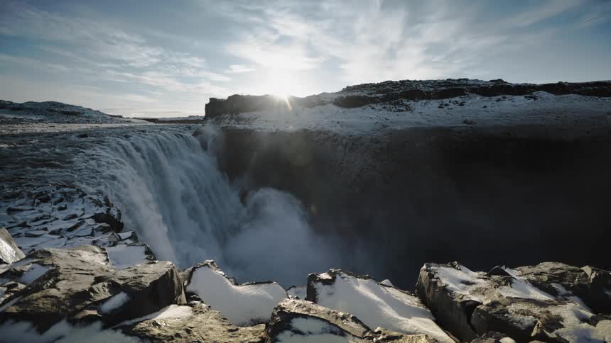Water flowing over a cliff on a winter day