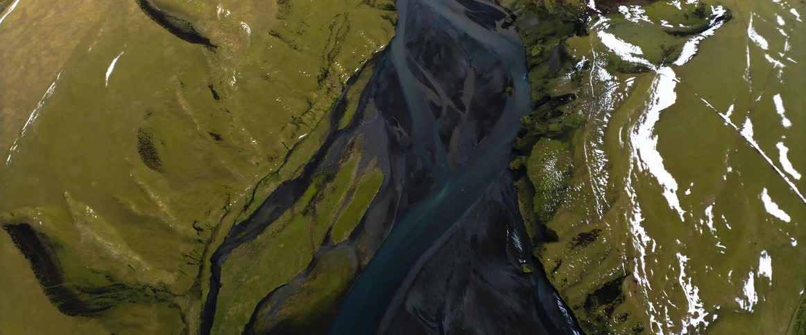 An art piece mimics a river running through a canyon