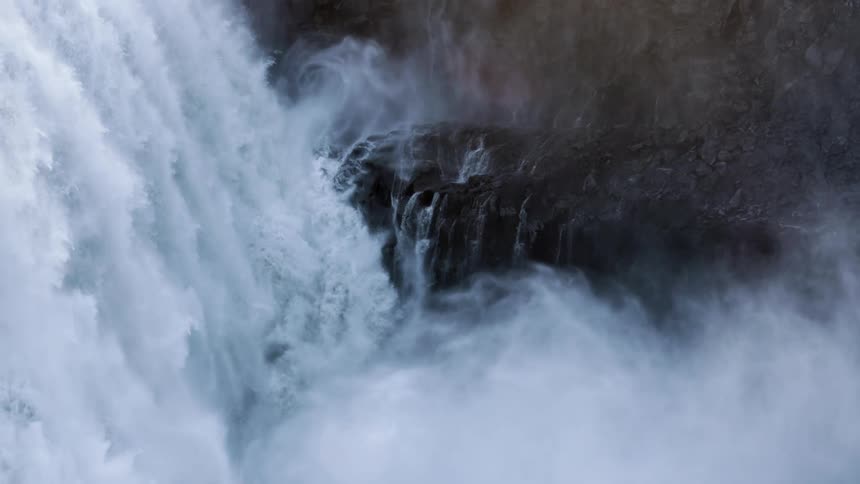 A view of a waterfall in the middle of the day