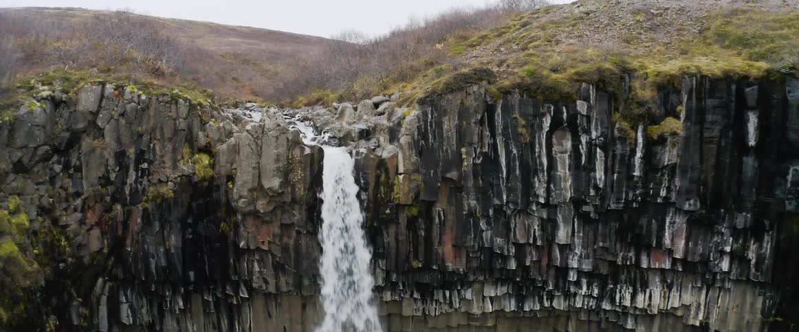 A view of a river that becomes a waterfall