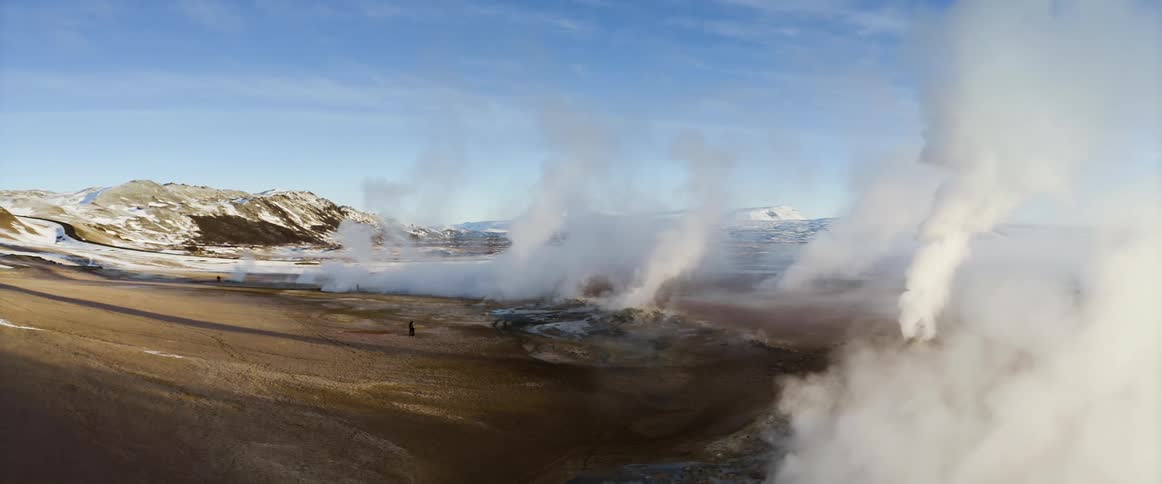 Steam rising from geysers in nature on a winter day