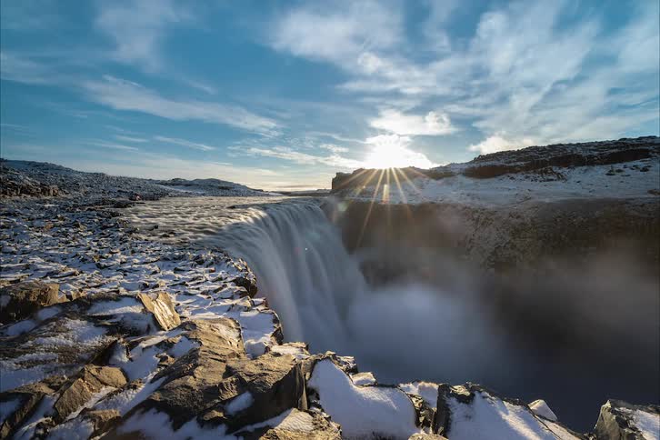 Water flowing over a cliff in the wilderness on a cold winter morning