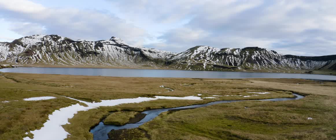 A river and snowy mountains in nature