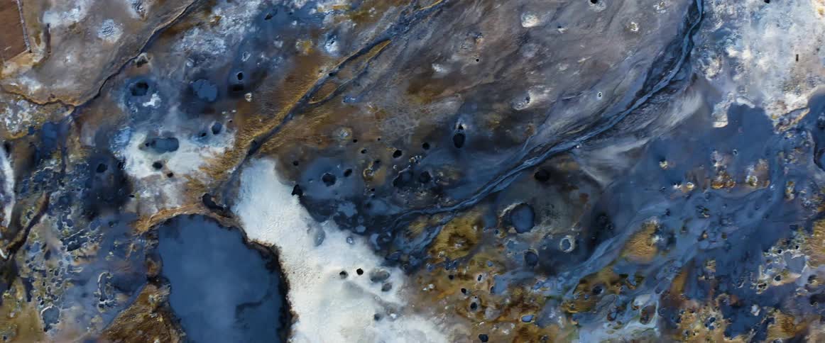 Steam rising from geysers and the earth