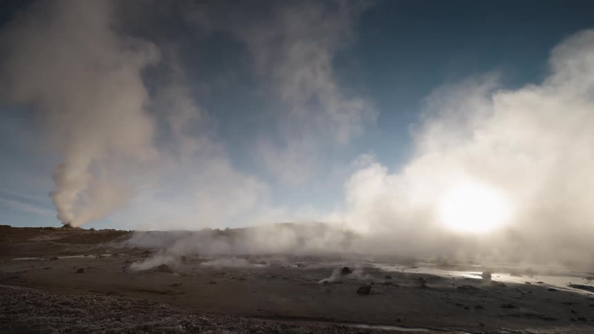 Steam rising from hot springs in nature