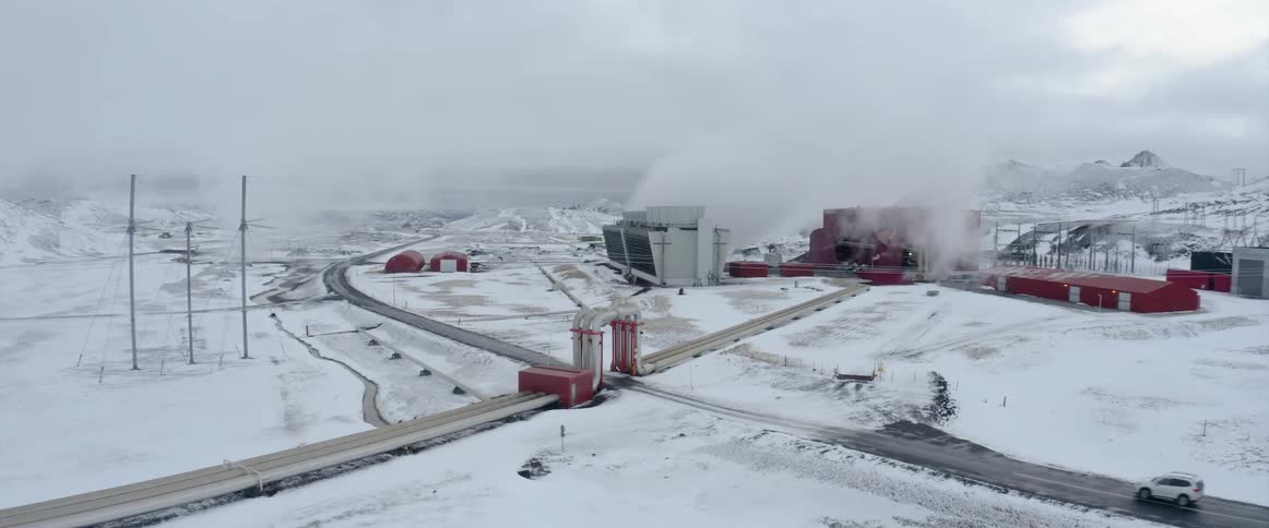 Camera pans slowly towards a plant or factory in the winter