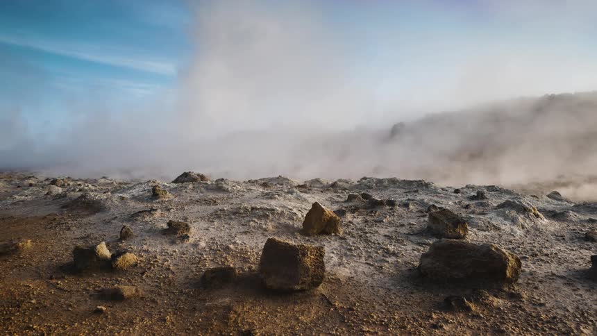 Steam floating over rocky ground in nature