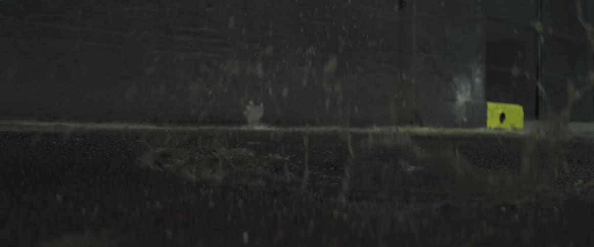 Boy running and stepping in a puddle of water