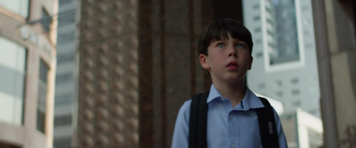 Child looks around fearfully and takes a step forward and looks around again