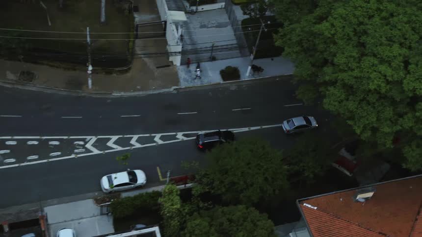Camera tracks with cars driving down a clear road