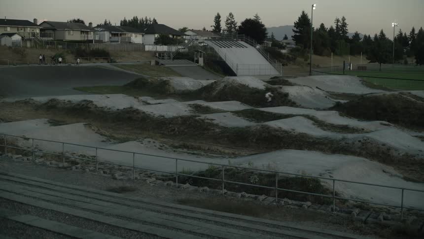 A person is jumping hills on his bicycle
