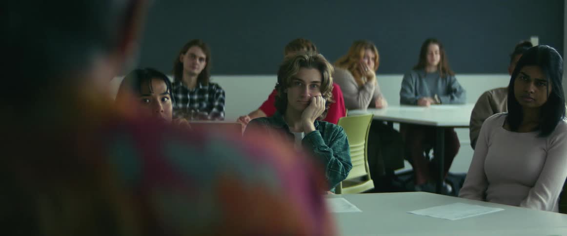 Students look bored as they listen to the teacher speak