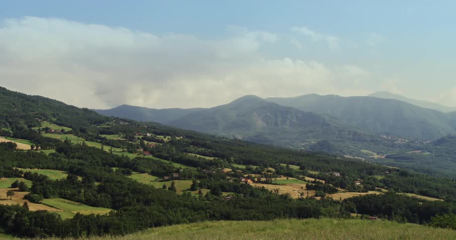 A rural countryside checkered with forest and fields