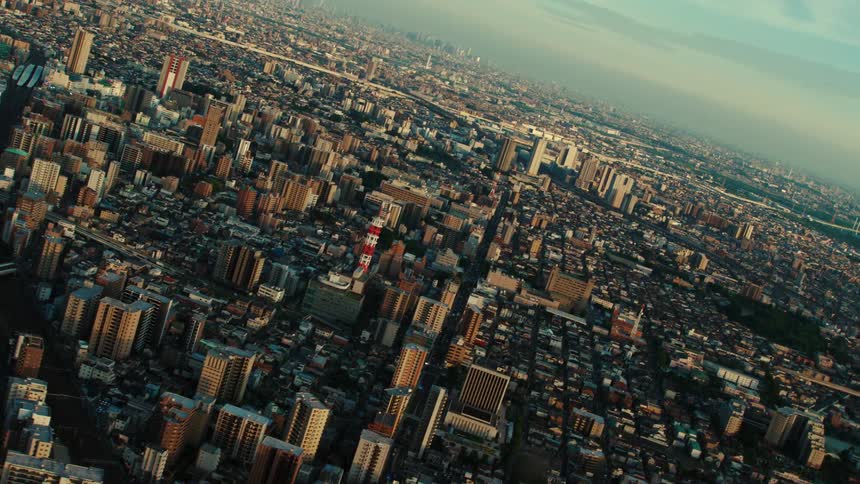 Neighborhoods sit nestled between skyscrapers in a congested city