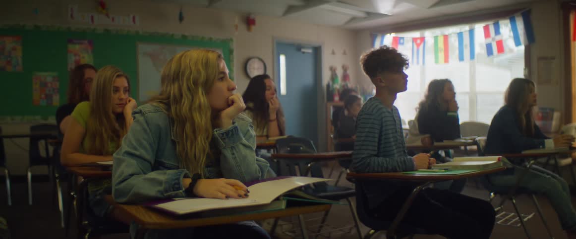 Students sit and listen in a classroom