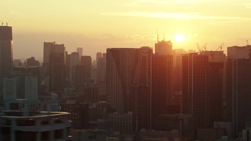The sun is rising on the city