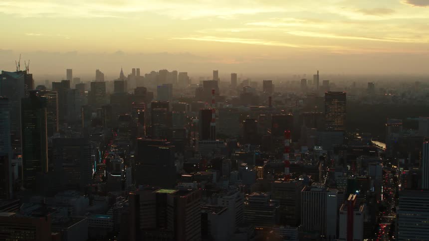 Smog obscures skyline near the horizon under a red tinted sky