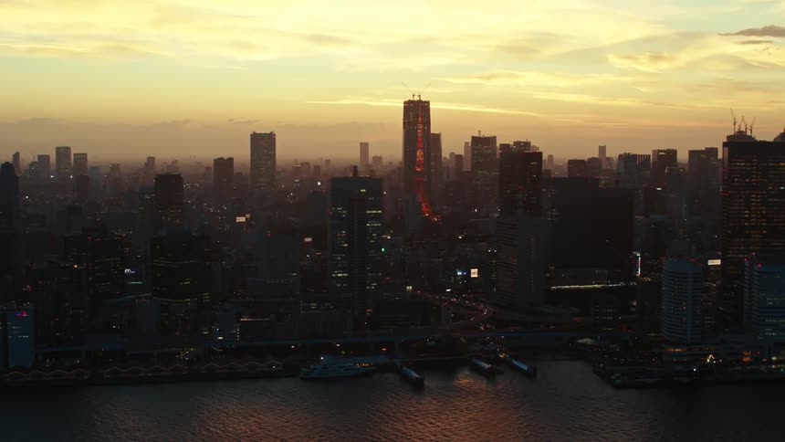 Heavy fog sits over a congested city along the coast