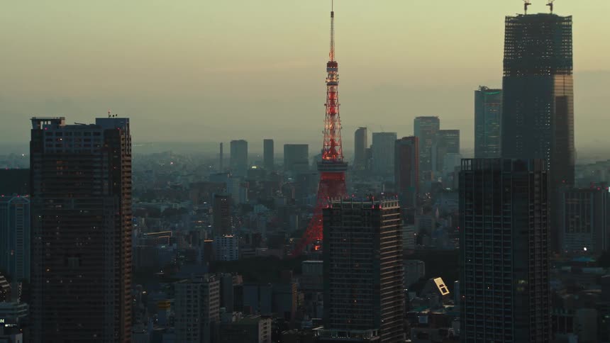 Smog blankets a large city as the sun is setting