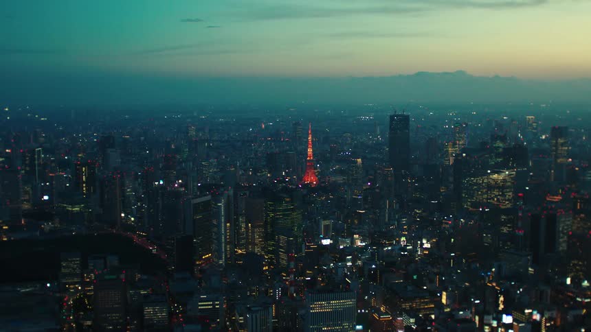 The city is brightly lit at sunset