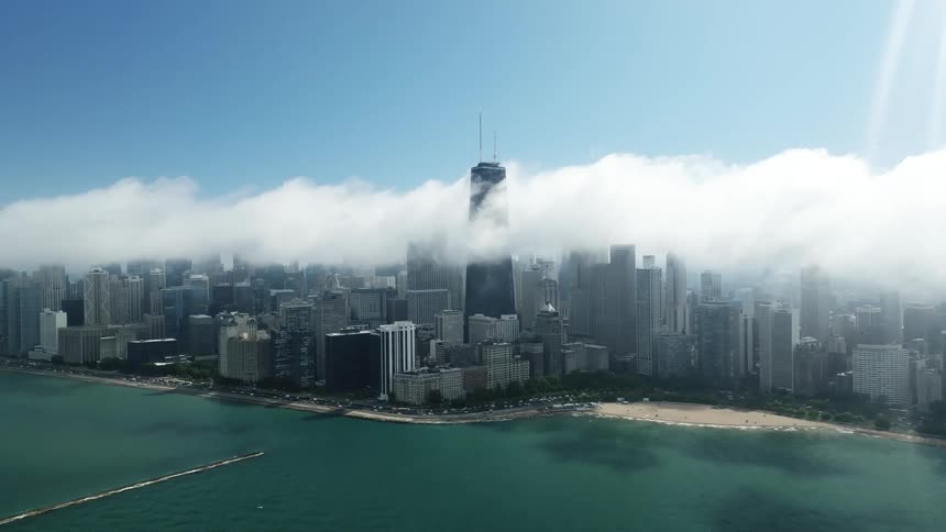 An aerial view of urban skyscrapers on a cloudy day