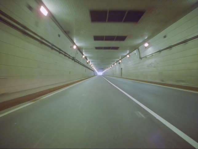 A view of an underground tunnel for vehicles is displayed