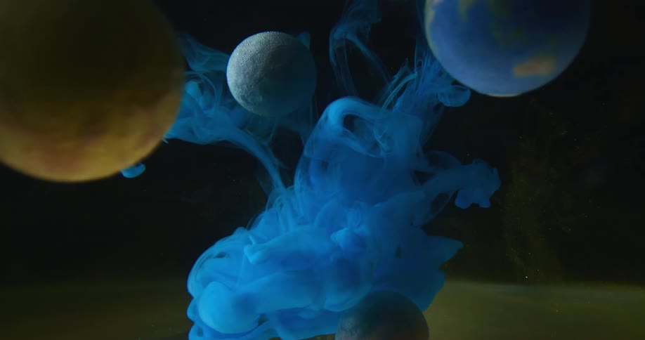 Abstract footage of paint mixing in liquid