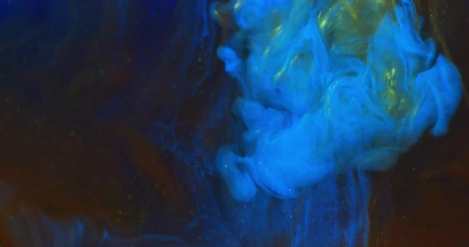 Abstract footage of paint mixing in liquid