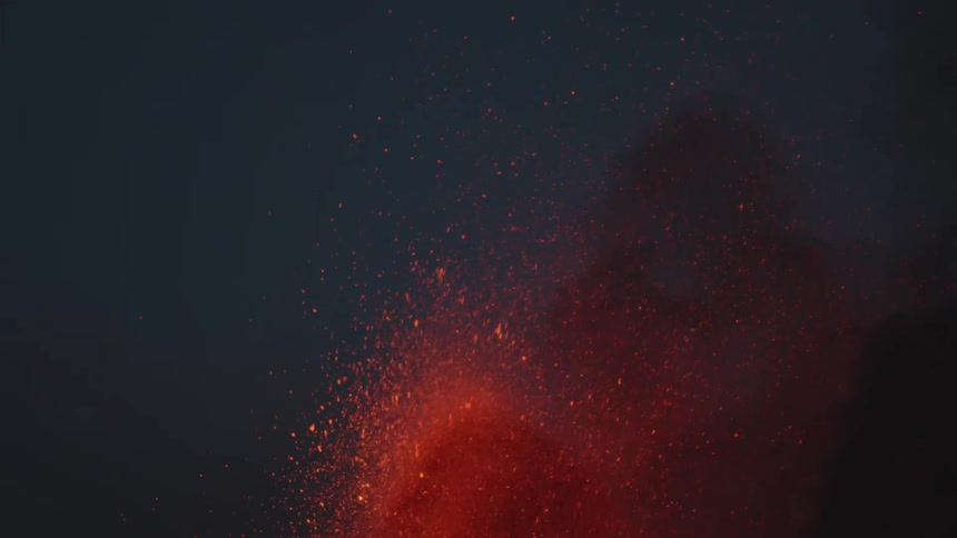 Lava erupting into the night sky