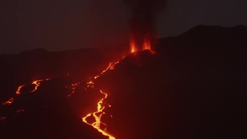 Lava flowing as a volcano erupts