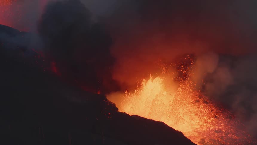 Close up of lava and smoke as a volcano erupts