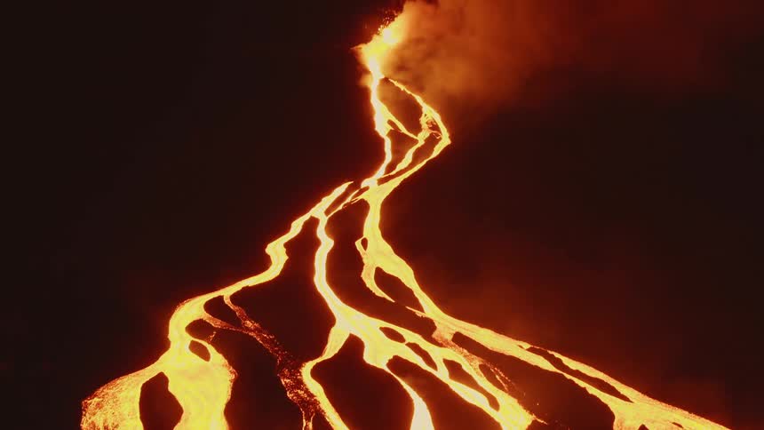 Lava and smoke as a volcano erupts