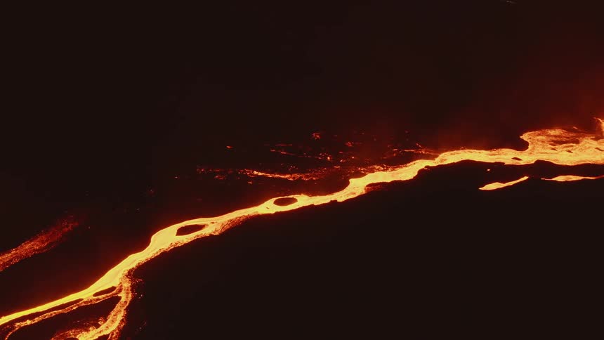 Lava flows form rivulets that glow in the dark