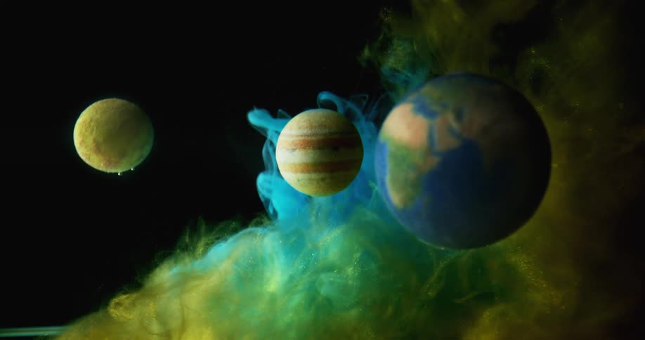 Planets in space with colored mist floating