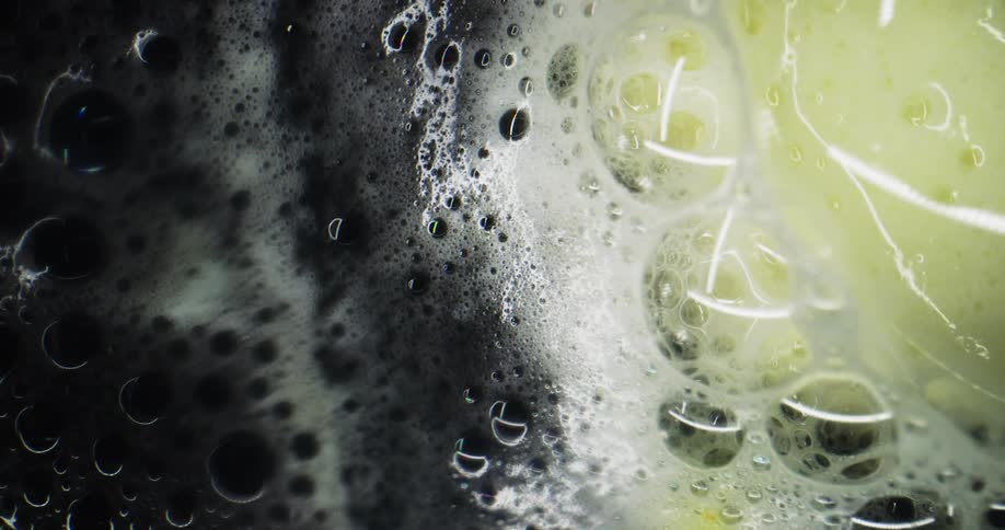 Abstract footage of bubbles and foam in liquid