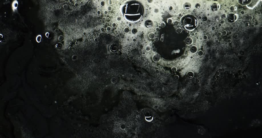 Soapy bubbles move around as they grow