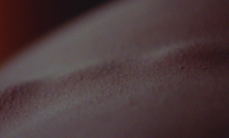 Close view of goose bumps on a persons spine