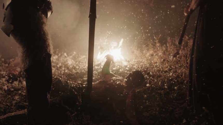 A man raises his sword and kills a man on the ground