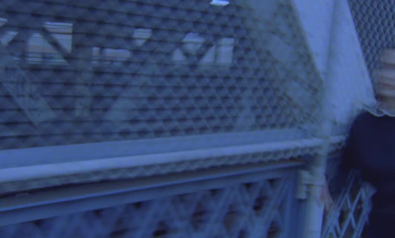 Time lapse of a woman running across a bridge