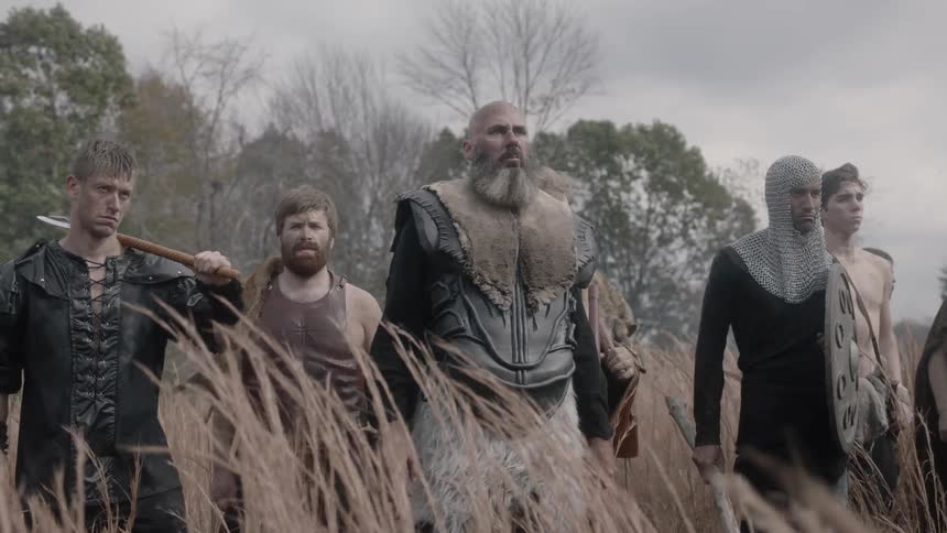 Warriors gathering in a grassy field